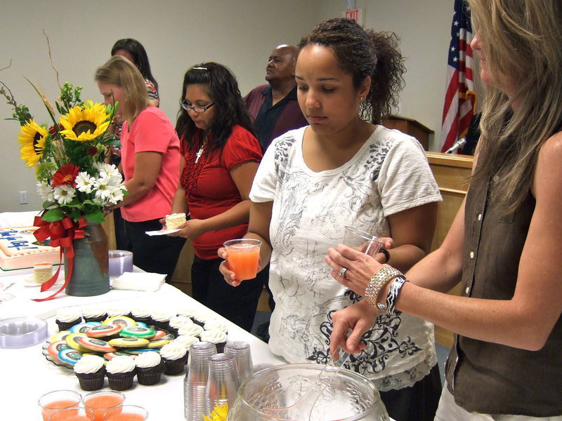 Image: Friends and co workers enjoying the celebration.