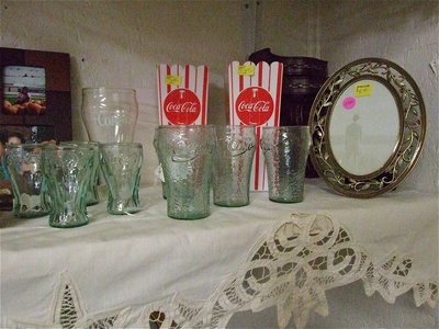 Image: Old Coca-Cola glasses and popcorn containers.