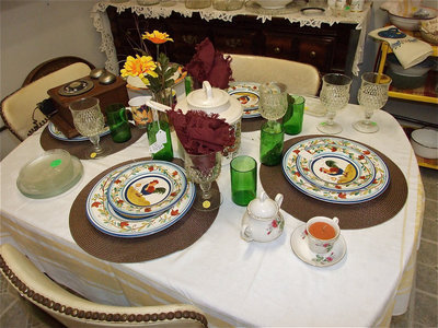 Image: Old fashion tables, chairs and dinnerware bring back memories of a slower time when entire families were able to enjoy a meal together.