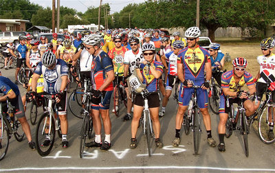Image: Cyclists line up as far back as the eye can see to begin the start of Tour d’Italia 2011.