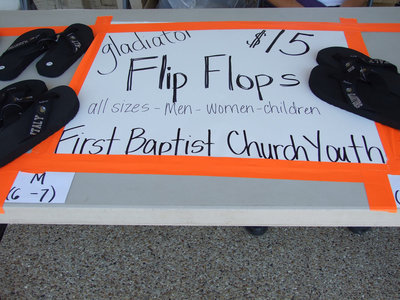 Image: The youth of First Baptist Church are selling Gladiator flip flops.  This will help fund a ski trip next winter.
