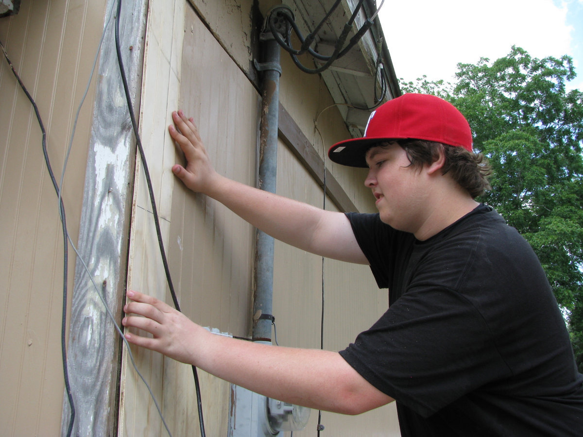 Image: Tristan fits boards for the house.