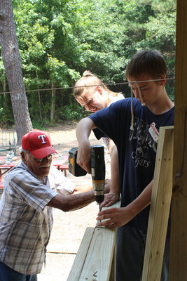 Image: Adult sponsor, Alex Flores, helped the youth with handrails.