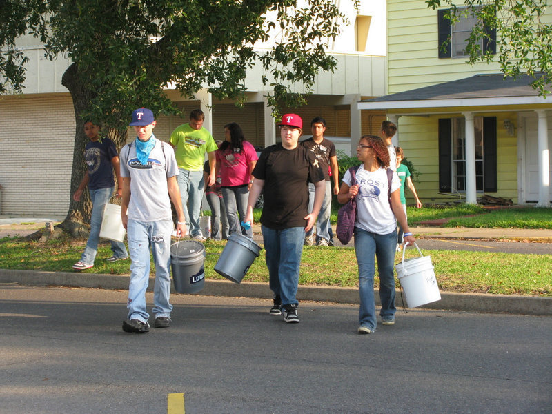 Image: Alex DeMoss and Tristan Smithwick head out with their group and their tools.