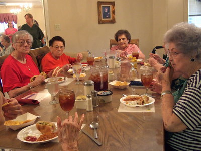 Image: These residents are enjoying the food and festivities.