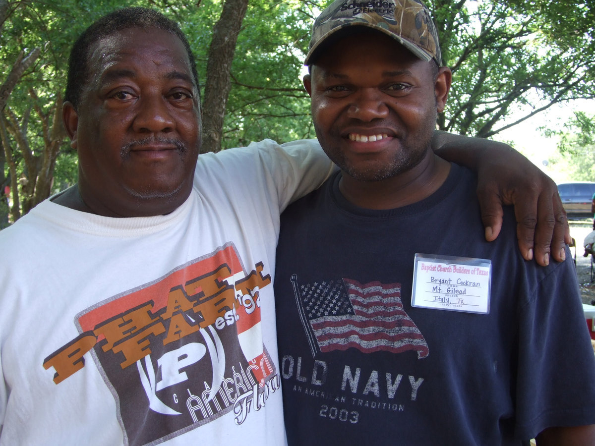 Image: Kenneth Copeland and Bryant Cockran of Mt. Gilead Missionary Baptist Church are blessed from others’ charity.