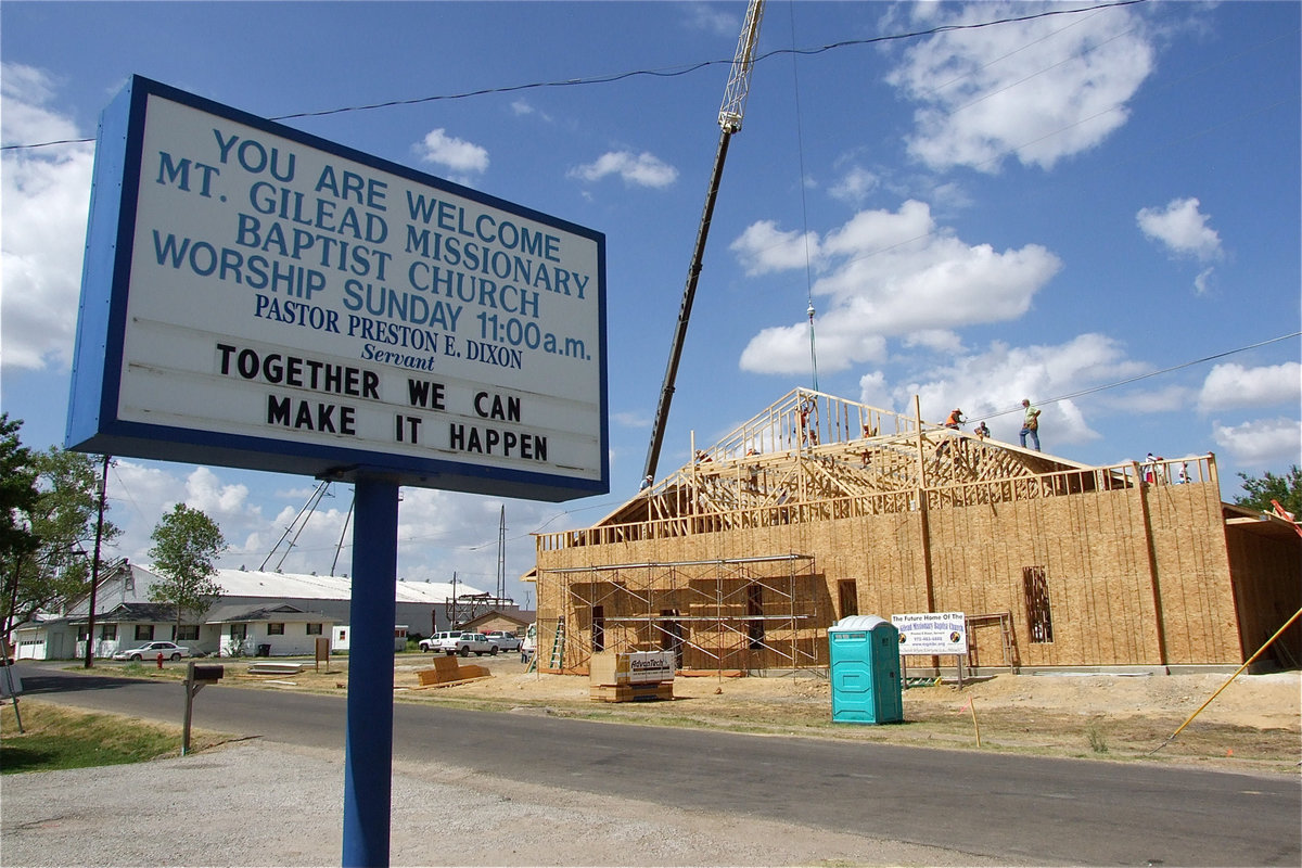 Image: Pastor Preston Dixon proudly displays the motto, ‘Together we can make it happen,’ on the current church’s marquee.