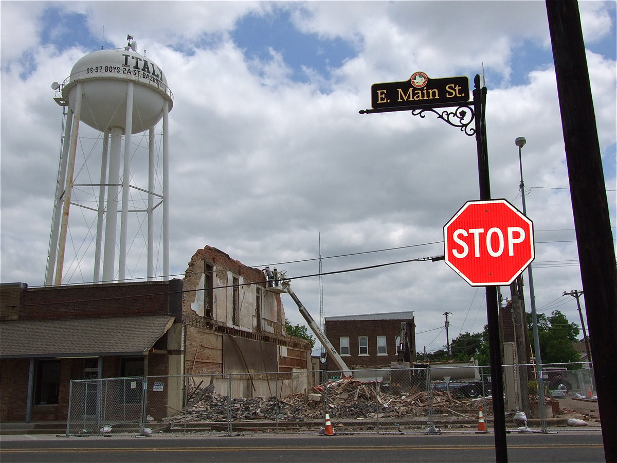 Image: Unable to stop the inevitable, the old community center building is pulled completely down into a pile of rubble.