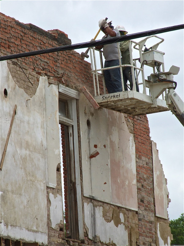 Image: Workers chip away at our town’s history.