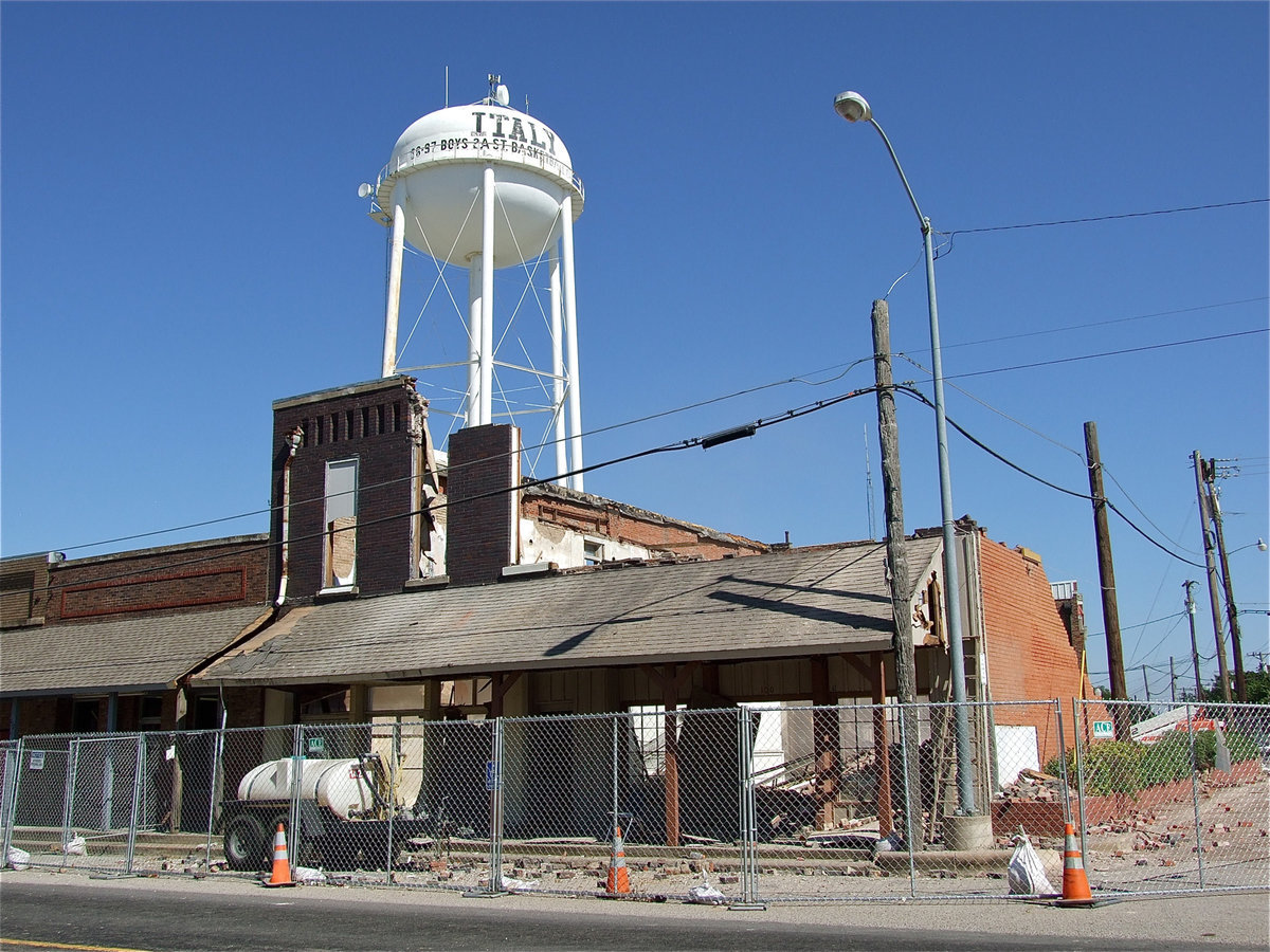 Image: Demolition begins and bricks fall like tears.