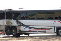 Image: A closer look of the burned and melted bus. 