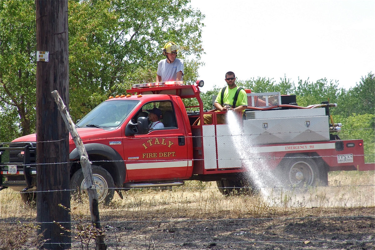 Image: Italy fire crews continue to douse the country side.