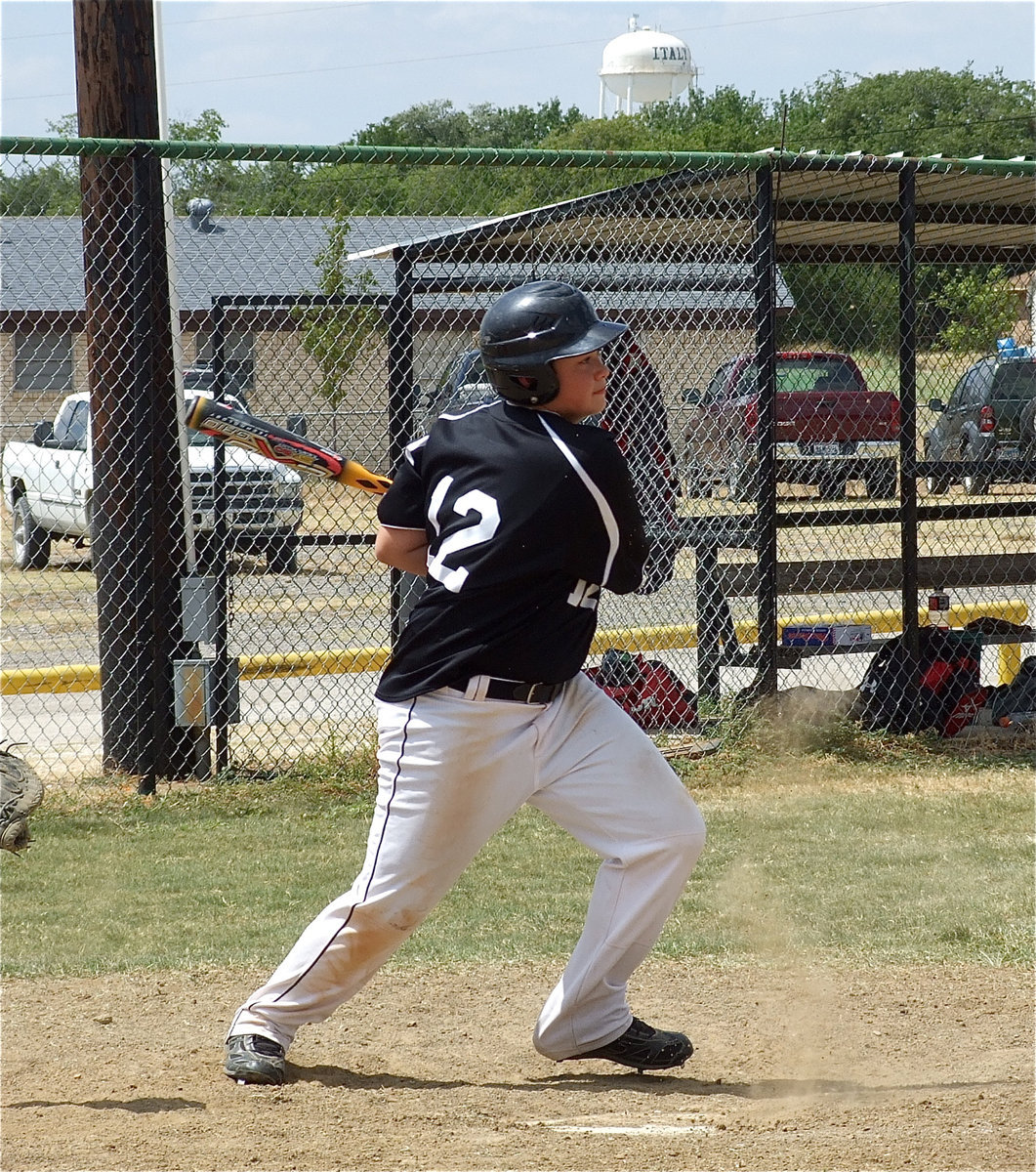 Image: Zain Byers(12) shoots one toward the mound.