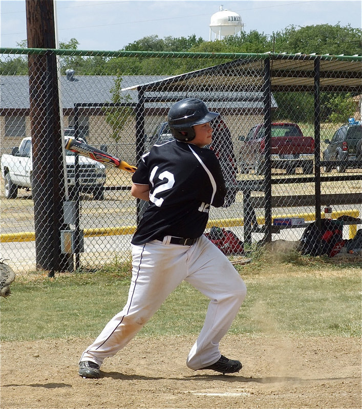 Image: Zain Byers(12) shoots one toward the mound.