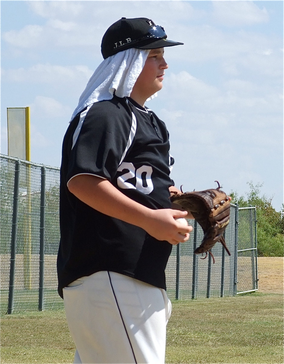 Image: Italy’s John Byers(20) tries to stay cool before taking the field against Valley Mills in Hillsboro during tournament play.