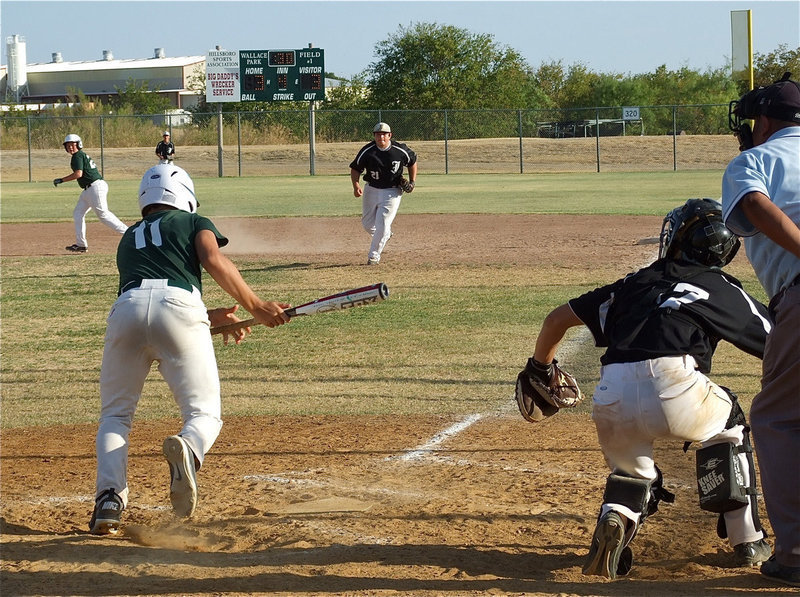 Image: Catcher Brandon Souder(17) and first baseman Kevin Roldan(21) converge on the ball for Italy.
