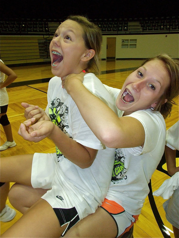 Image: Camp coach Bailey Bumpus offers a more subtle approach when trying to instruct camper Bailey Eubank.