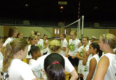 Image: Coach Heather Richters stops camp to game plan the next drill.