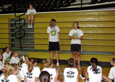 Image: Coach Heather Richters and Kaitlyn Rossa pass out the camp awards.
