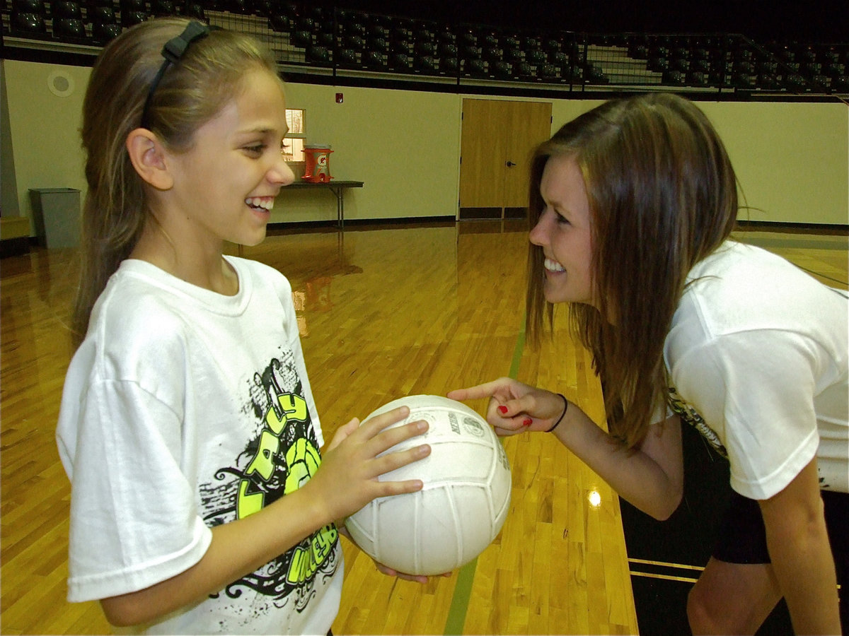 Image: Haley Bowles takes a few pointers from Lady Gladiator and camp coach, Kaitlyn Rossa.