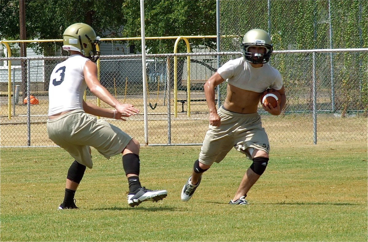 Image: Jase Holden closes in on Tony Wooldridge during defensive secondary drills.