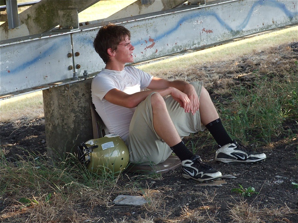 Image: Justin Wood takes a break from the heat.