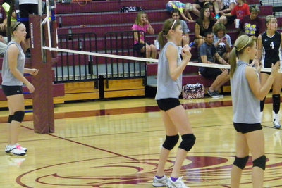 Image: Lewis, Rossa and freshman, Bailey Eubank read the players on the other side of the net.