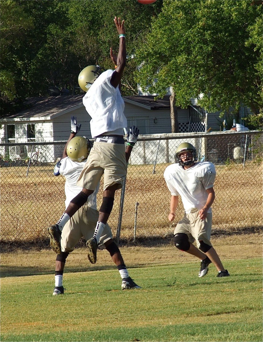 Image: Devonta Simmons skies for an interception.