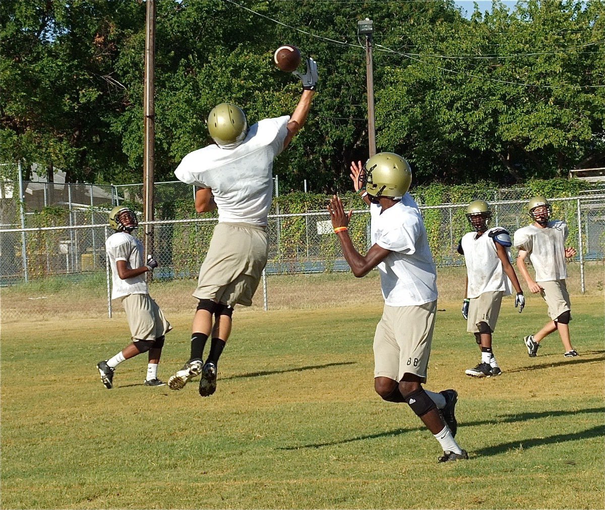 Image: Chase Hamilton deflects a pass intended for teammate Devonta Simmons.