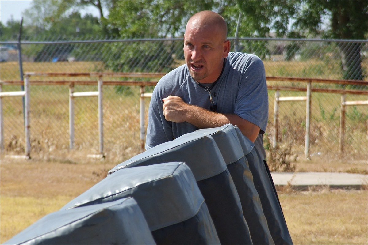 Image: Coach Jeff Richters talks to the line about blocking technique.