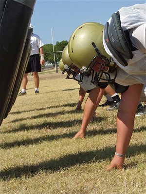 Image: Isaac Medrano joins his fellow linemen on the sled.