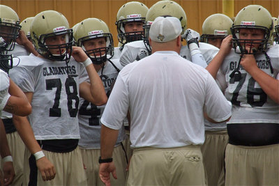 Image: Head coach Craig Bales gives his Gladiators one last pep talk before their scrimmage against Valley Mills.