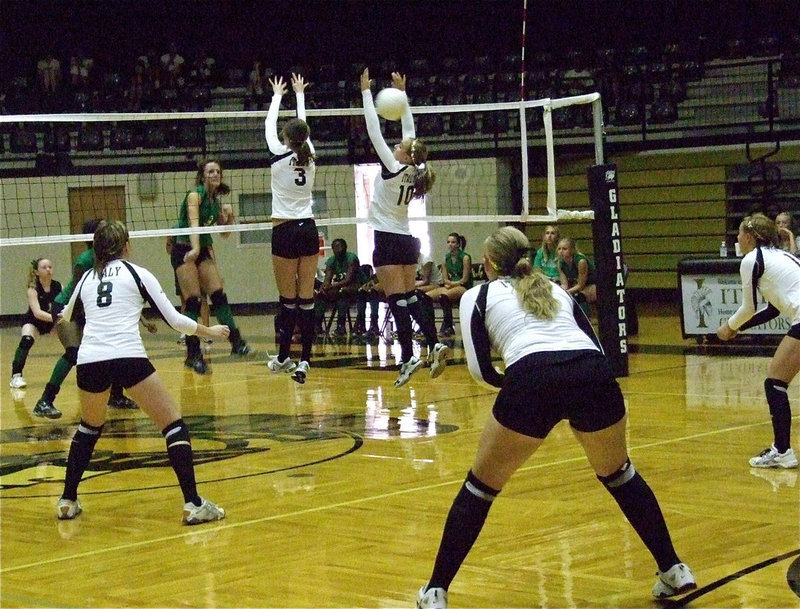 Image: Kaitlyn Rossa(3) and teammate Madison Washington(10) attempt a block.