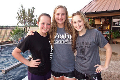 Image: Maddie Pittman, Madison Washington and Kelsey Nelson hoped to be dry by the first day of school.