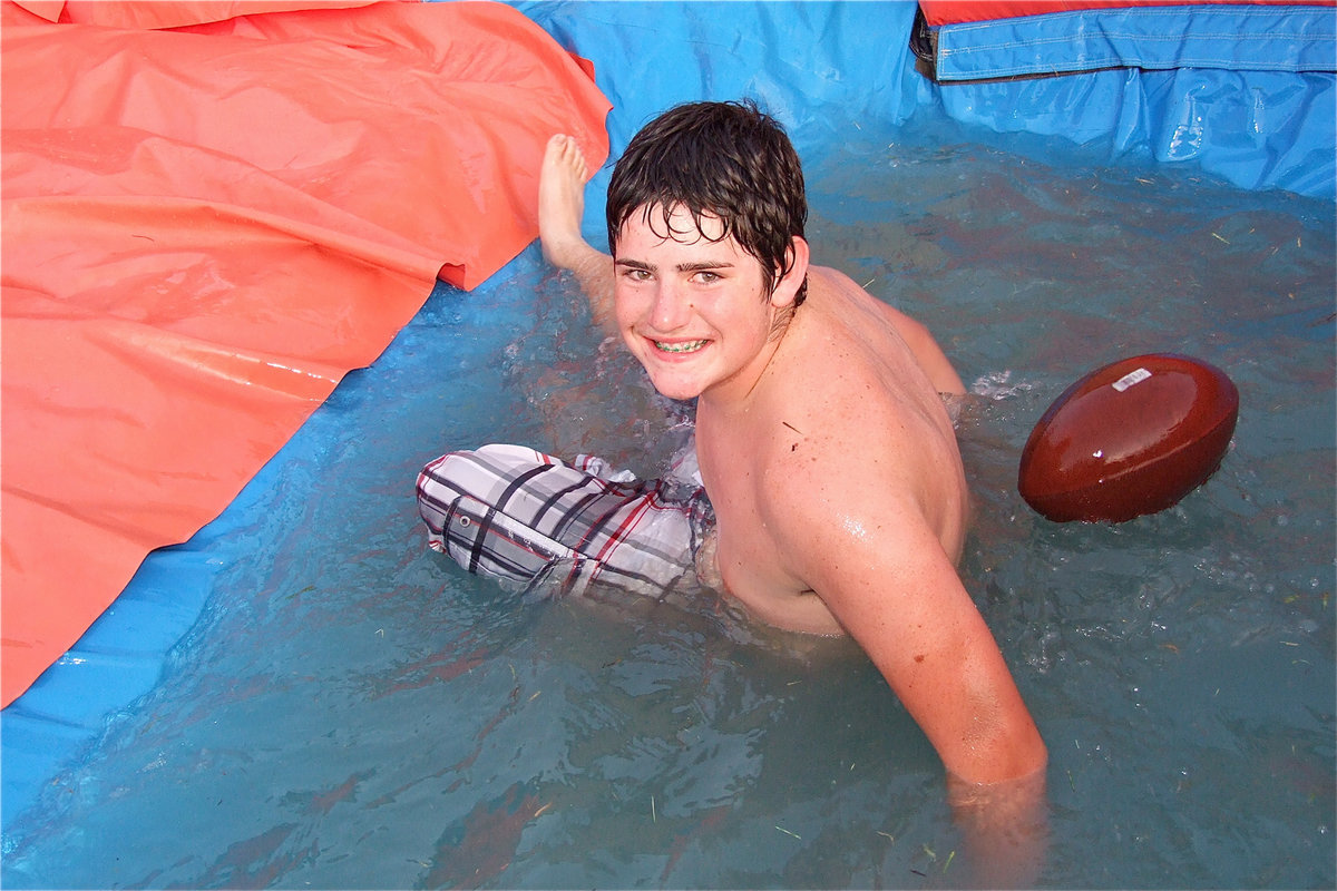 Image: Kyle Fortenberry, adds excitement to the water slide by pretending to dive into the endzone.