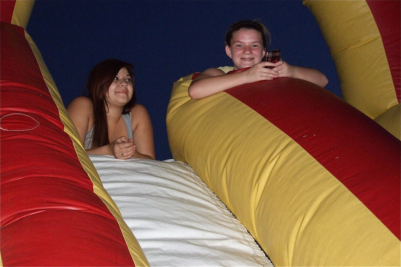 Image: Juanita Garcia and Tara Wallis take a break at the top of the obstacle course.