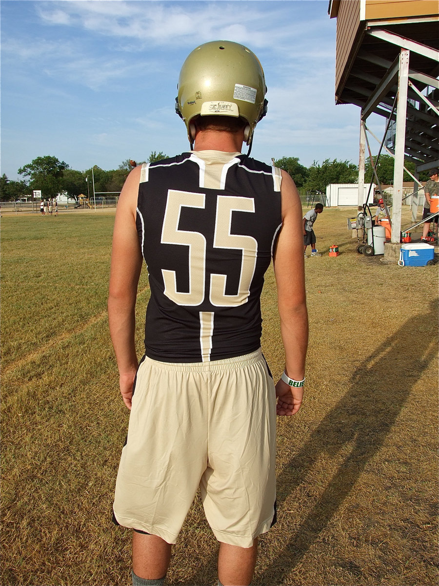 Image: Zach Boykin displays the back design of the new Gladiator under armour.