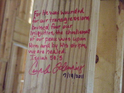 Image: The builders wrote special verses on the lumber and will always be there, even when the sheet rock is placed.