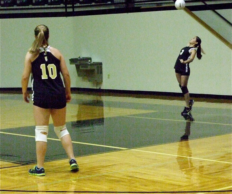 Image: Paige Westbrook(10) watches Paola Mata(3) deliver her serve. 