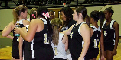 Image: JV head coach Tina Richards huddles with the team.