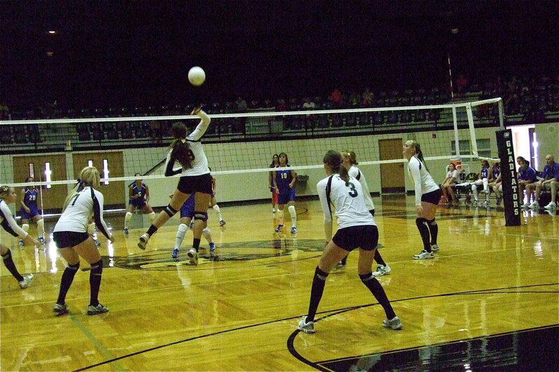 Image: Italy’s Alyssa Richards(9) leaps for the return shot.