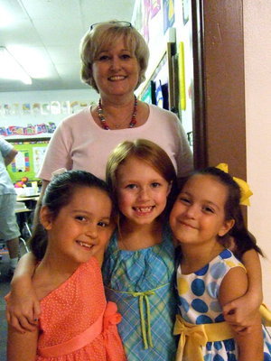 Image: Patsy Hernandez (secretary to the superintendent) and her three grandchildren, Kimree Gill, Jolie Olsen and Kaylee Gill.