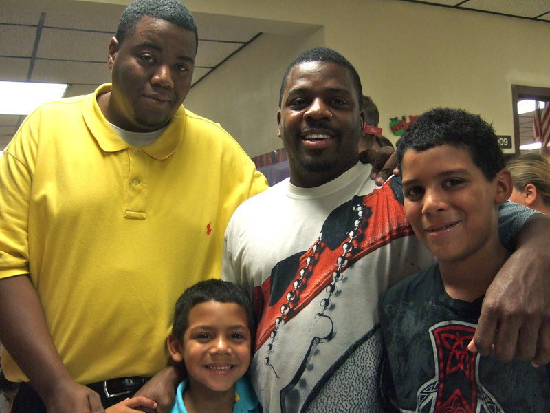 Image: Principal Miller, Jalen Wallace, Edwin Wallace (dad ) and Tylan Wallace. Jalen is in first grade and his teacher is Mrs. McCleskey and Tylan is in the sixth grade and his teacher is Debra Prowell.