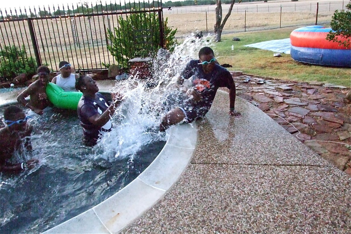 Image: Jimesha Reed refuses to allow, Larry Mayberry, Jr., to take a break from the pool.