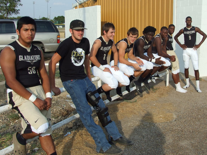 Image: Members of the Gladiator varsity team wait their turn to take on the Waco Reicher Cougars Friday night.