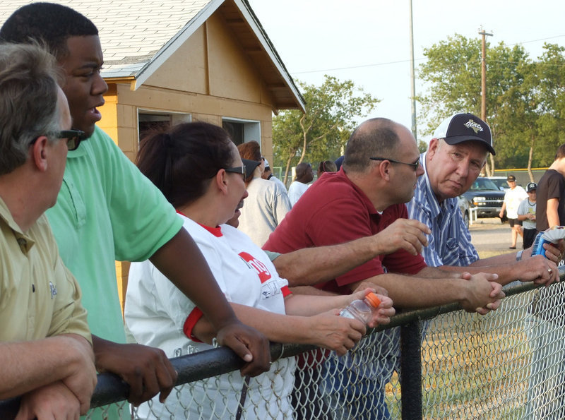 Image: The new administration watches from the fence line.  (L-R) New IISD Superintendent Barry Bassett, Stafford Principal Jason Miller, Italy High School Principal Lee Joffre and Gladiator Fan of the Year, Richard Cook, enjoy the Friday night scrimmage.