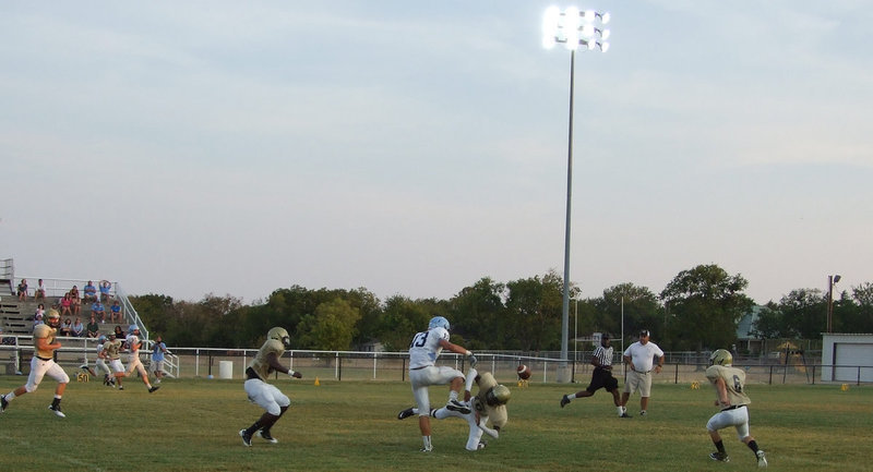 Image: Devonta Simmons, drills a Cougar receiver and dislodges the ball.