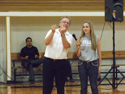 Image: New Italy ISD Superintendent, Barry Bassett, and Kelsey Nelson make it “rain” in the gym.