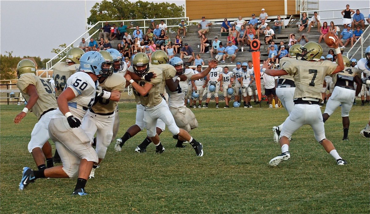 Image: The Gladiators offensive line buys time for quarterback, Jase Holden(7).