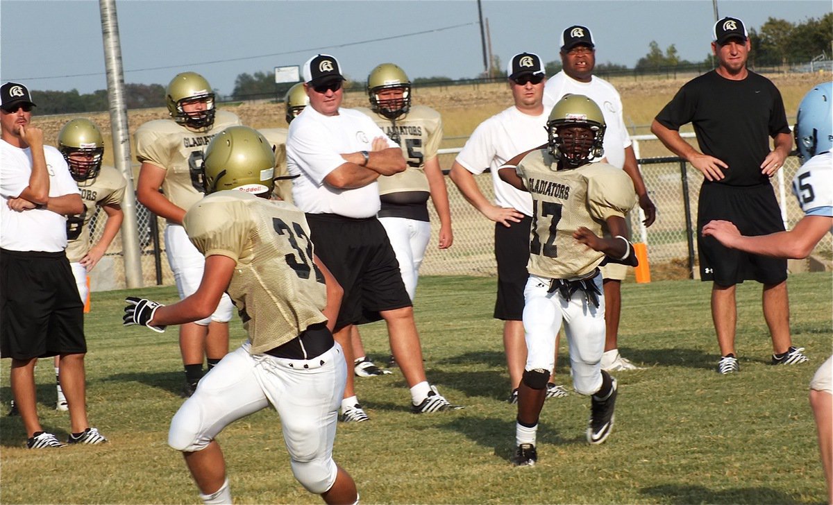 Image: JV quarterback, Eric Carson(17), prepares to launch a pass.